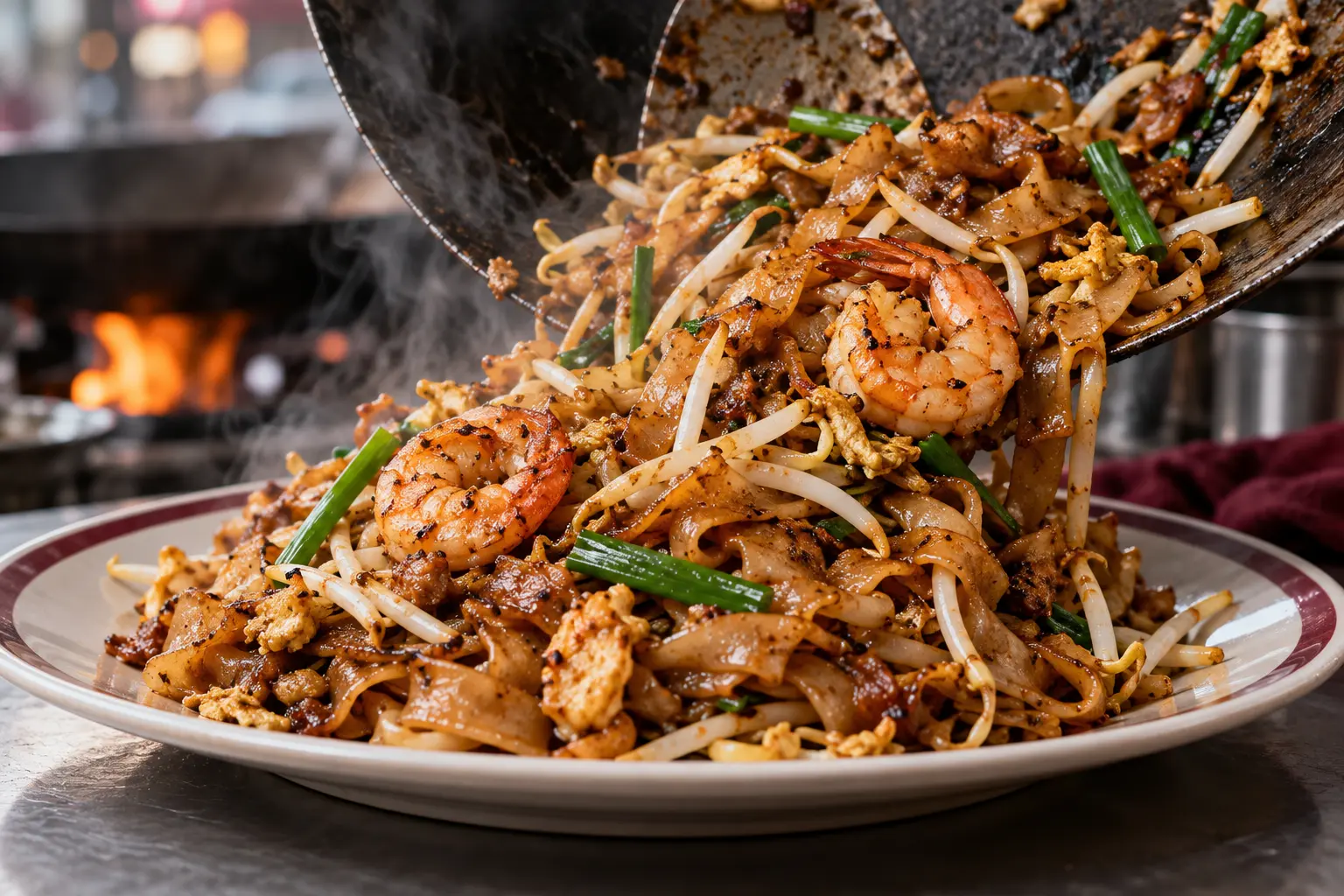 A wok-fried plate of char kway teow with prawns, egg and bean sprouts
